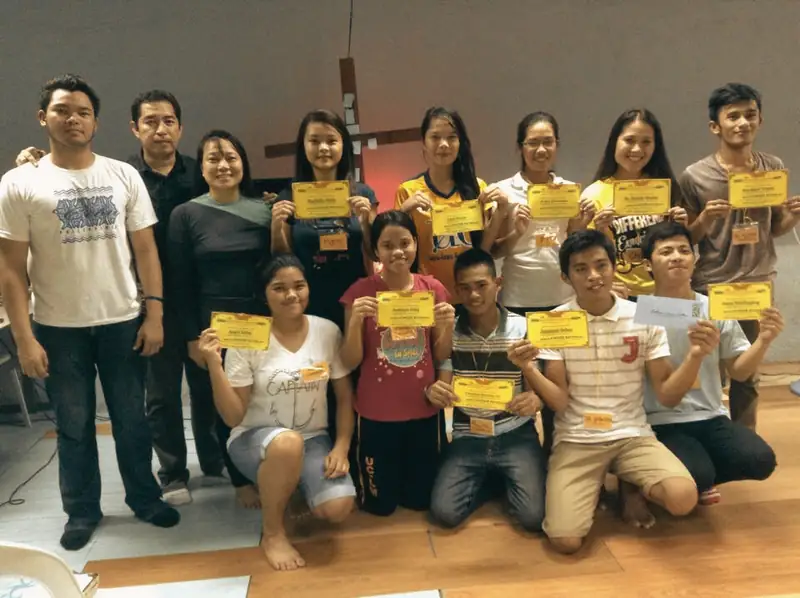 Young people holding certificates at an early CK gathering