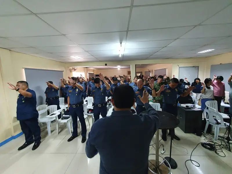 Officers worshipping during an encounter at the Cebu Provincial Police Office